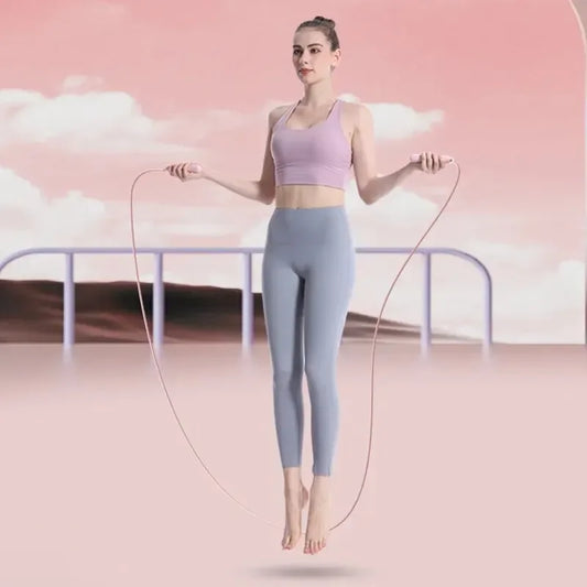 FitGearly electronic counting skipping rope with digital display for fitness workouts and countdown timer in a home gym setting.